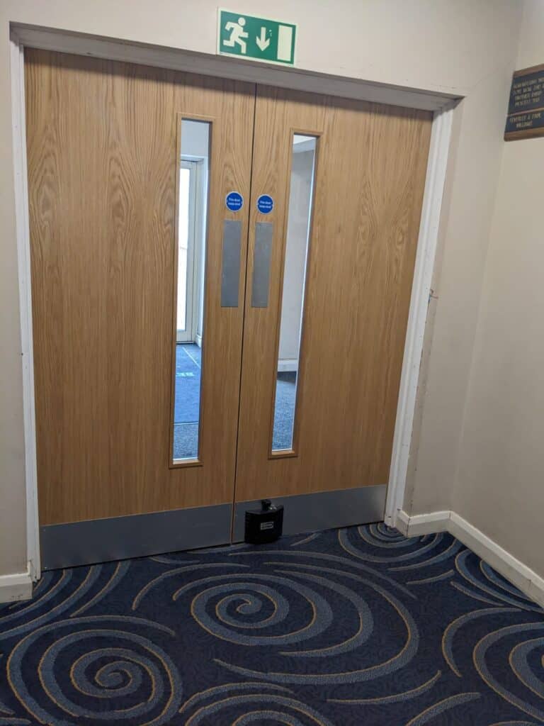 Fire door with new fire safety doors at Cookley Village Hall.