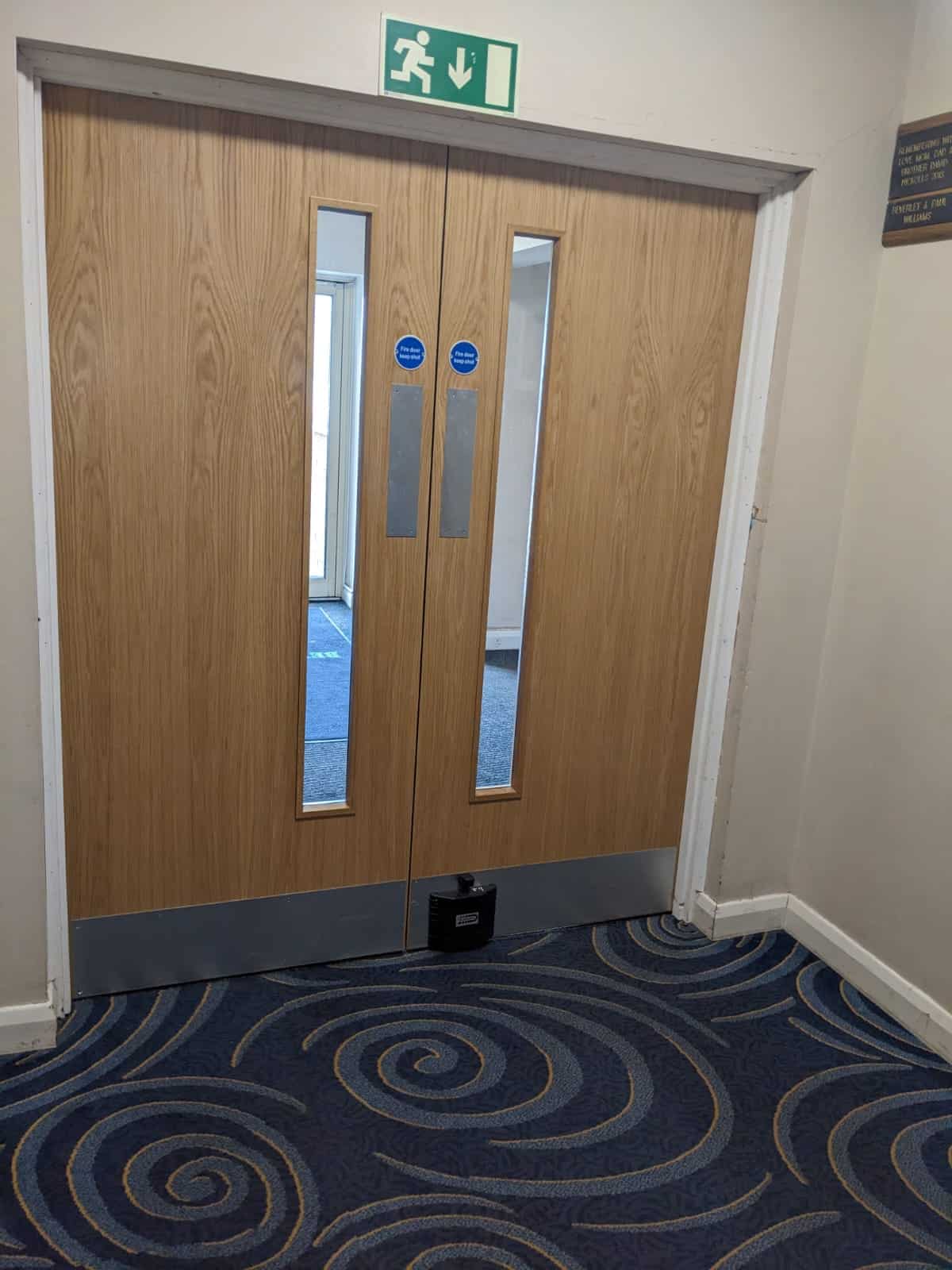 Fire door with new fire safety doors at Cookley Village Hall.