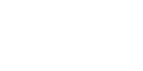 View of Cookley Village Hall and surrounding playing fields in daylight.